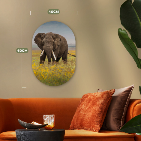 Muurovaal - Grazende olifant in een grasveld met bloemen-thumbnail-4