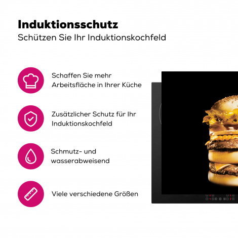 Herdabdeckplatte Goldener Hamburger auf schwarzem Hintergrund.-3
