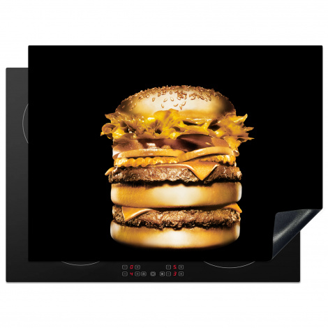 Inductiebeschermer - Gouden hamburger op een zwarte achtergrond.