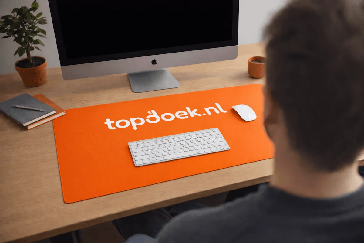 Bureau onderlegger met Topdoek logo erop