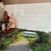 Doorkijk - Landschap - Natuur - Tuinboog - Bloemen Inductie beschermer vinyl 3mm middel -sfeer3