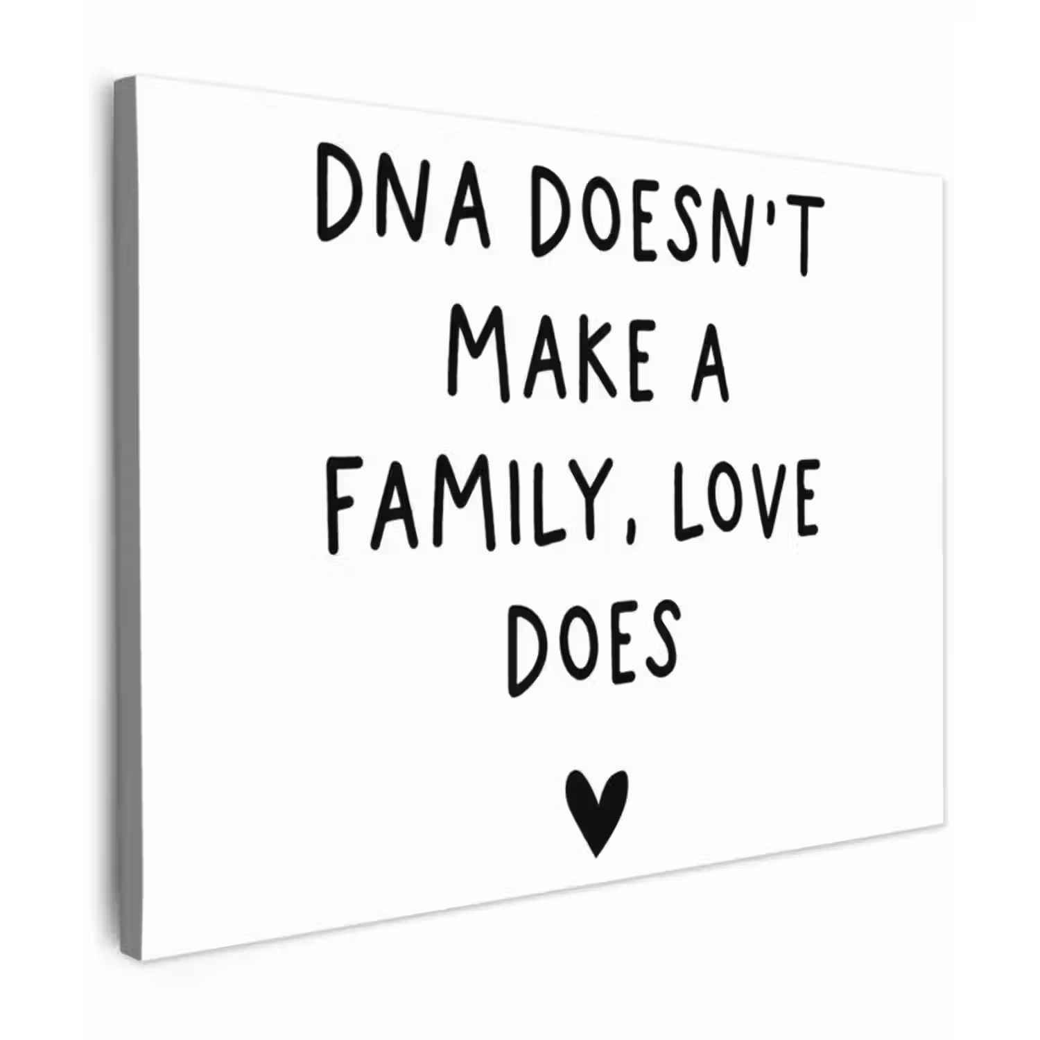Canvas schilderij - Engelse quote "DNA doesn't make a family, love does" met een hartje op een witte achtergrond