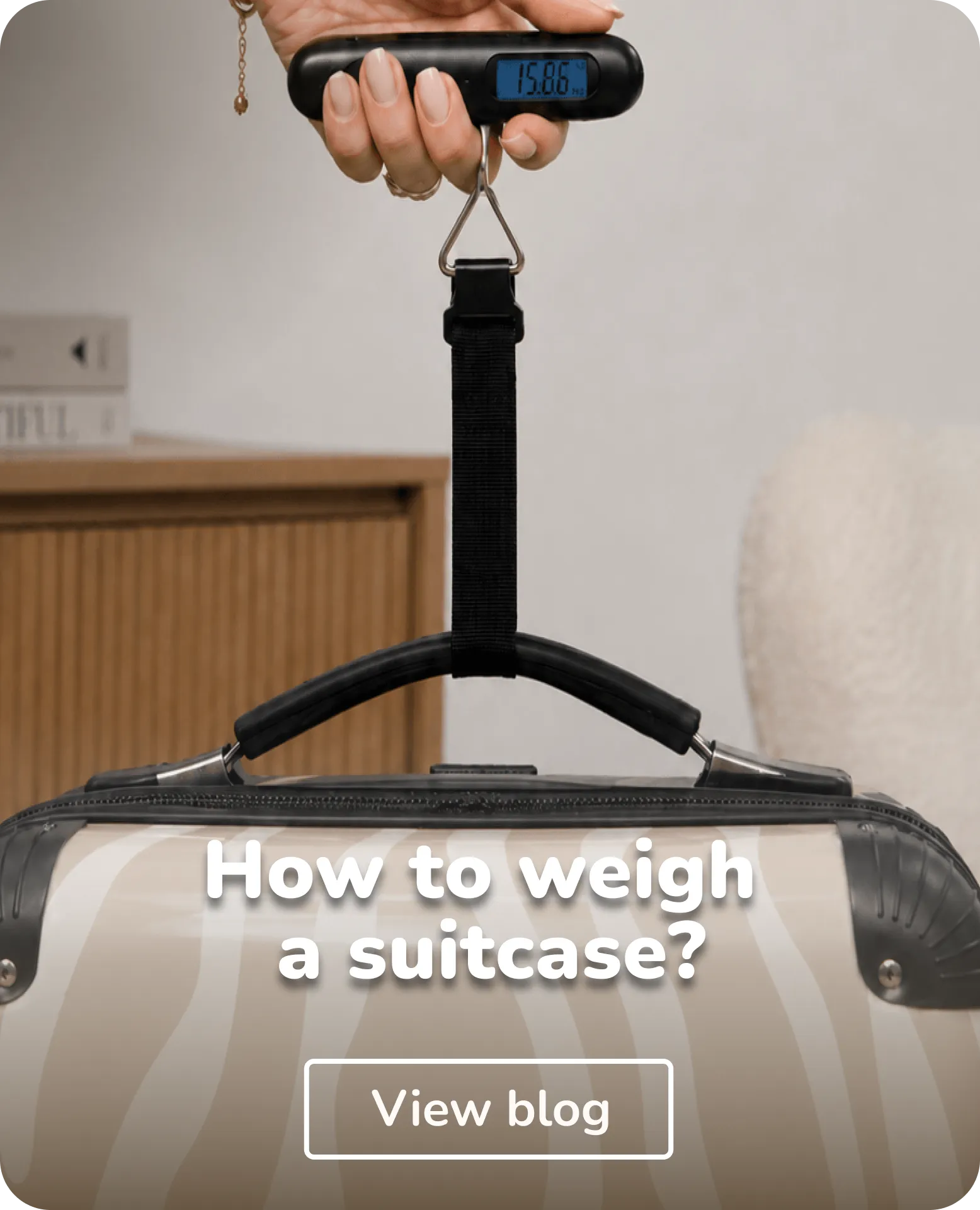 person weighing their suitcase