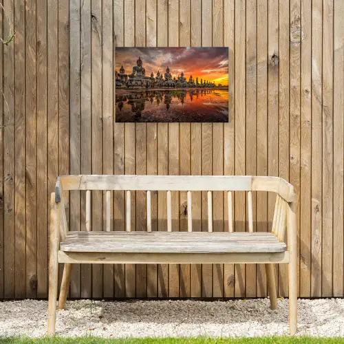 Rij van Boeddha-beelden bij zonsondergang Tuinposter op houten frame 2 cm dik klein -sfeer4
