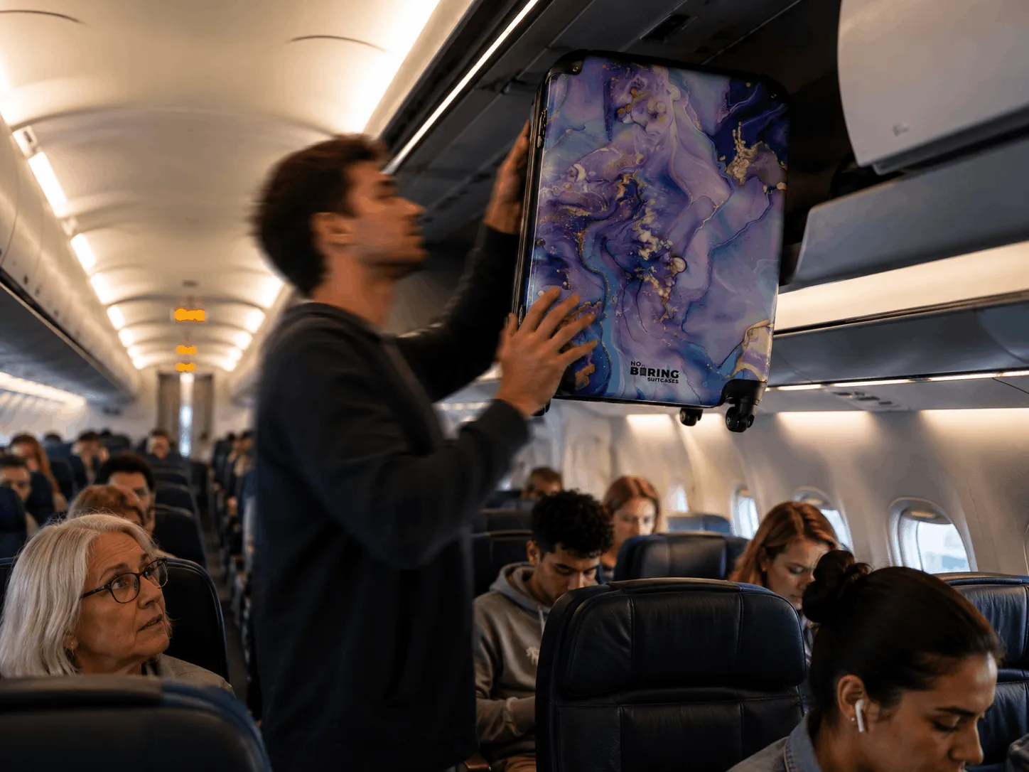 homme avec une valise cabine