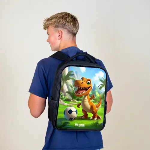 Dino met een voetbal in groen landschap Rugzak - Zwart middel -sfeer8
