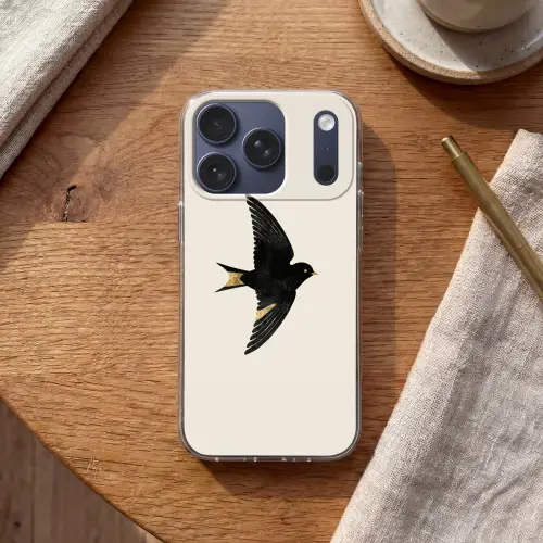 Zwarte zwaluw - Gouden accenten - Lichte achtergrond Telefoonhoesje iPhone 17 Pro klein -sfeer1