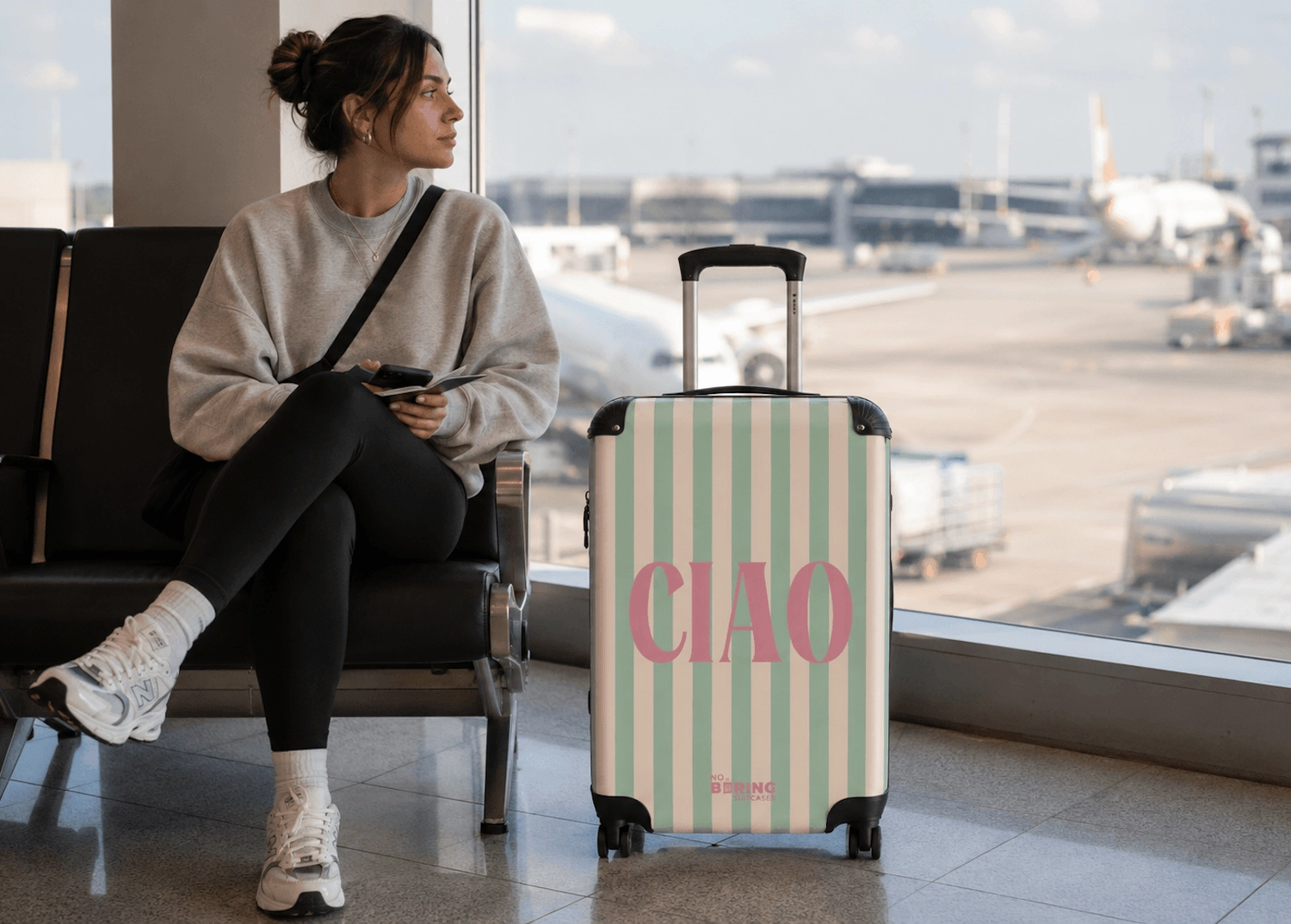 suitcase on airport with ciao on it