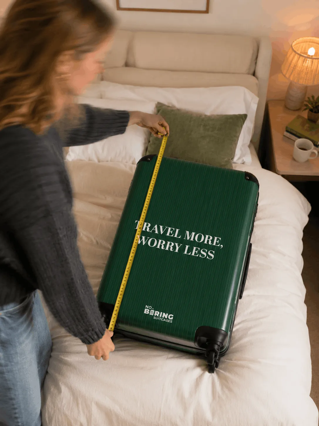 girl measuring suitcase